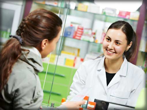 employee benefits photo showing woman talking to pharmacist